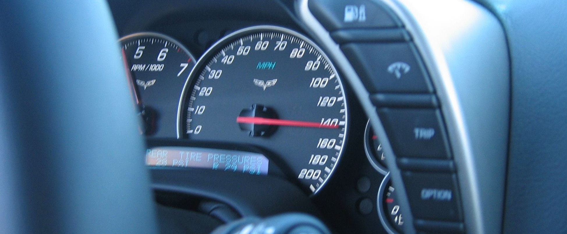 A picture of a car speedometer going 140 miles per hour.
